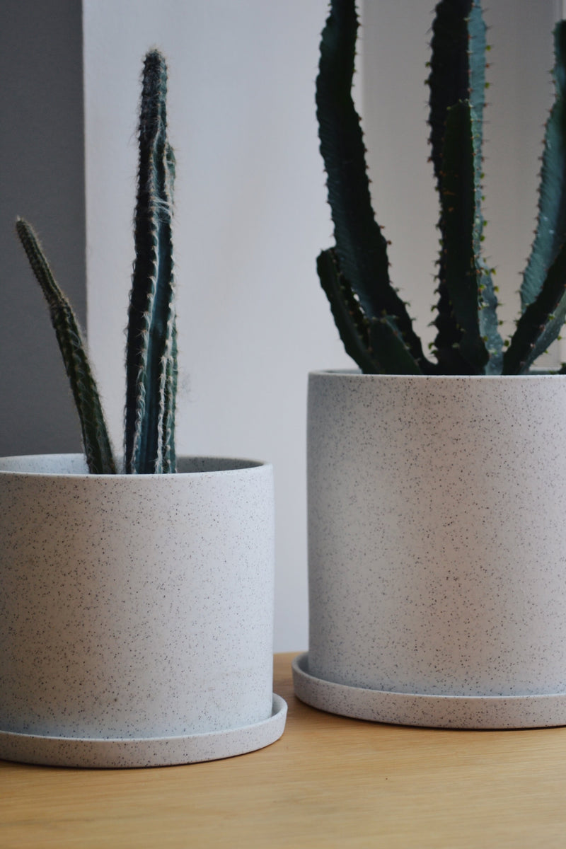 Set of Two White Ceramic Pots with Saucers