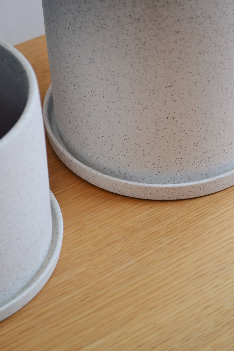 Set of Two White Ceramic Pots with Saucers